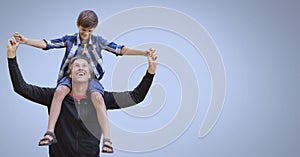 Father and son having fun playing with blue background