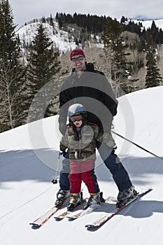 Father and Son Having Fun on the Ski Slopes