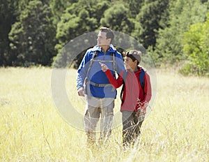 Father And Son On Hike In Beautiful Countryside