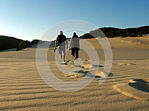 Father and son hiking fraser island photo