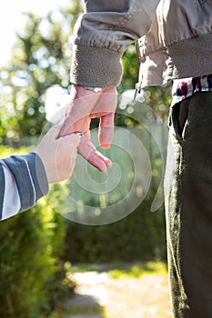 Father and son holding hands