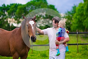 Father and son on a horse farm