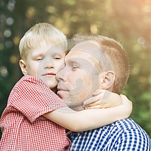 Father and son hugging.