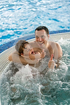 Father and son in jacuzzi