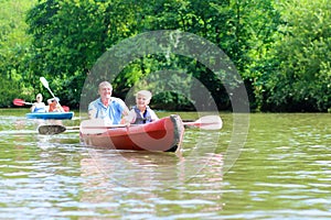 Father and son kayaking on the river