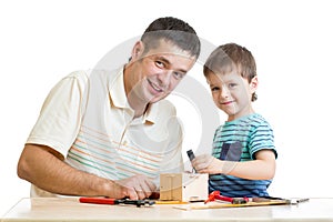 Father and son kid tinkering nesting box