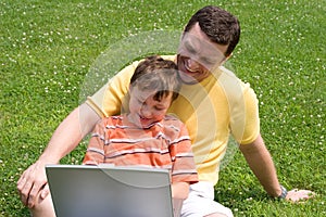 Father and son with laptop