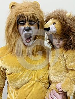 Father and Son in Lion Costumes