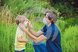 Father and son in a medical mask because of an allergy to ragweed