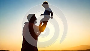 father and son in the park. father day silhouette happy family child dream concept