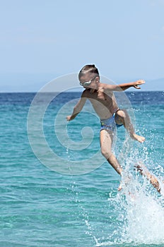 Father and son play in water