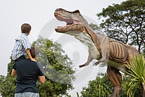 Father and son playing in the adventure dino park