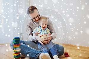 Father and son playing with ball clay at home