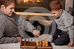 Father and son playing chess