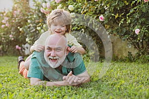 Father and son Playing - Family Time Together. Men generation. Cute child boy hugging his father. Happy father and son