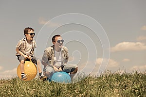 Father and son playing on the field