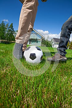 Father and son playing football