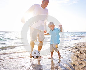 Father son playing football together Concept