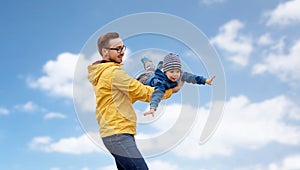 Father with son playing and having fun outdoors