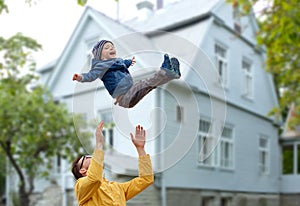 Father with son playing and having fun outdoors