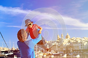 Father and son playing on the quay of Valetta, Malta