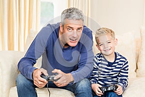 Father and son playing video games