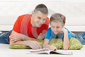 Father and son reading.