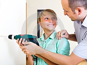Father and son repairing house