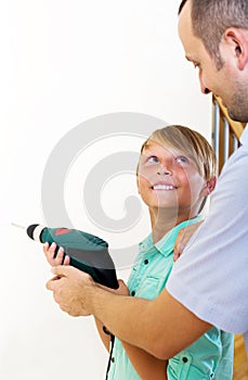 Father and son repairing house