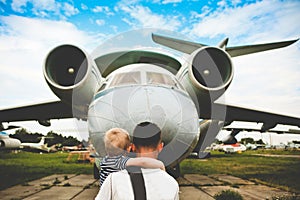 Father son retro aviation museum exploring plane