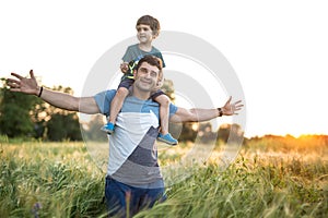 Father son in rye field