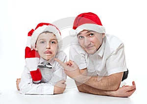 Father and son in Santa's hats