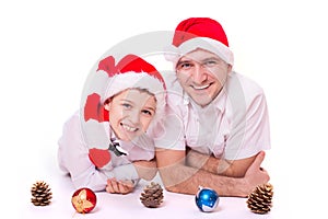 Father and son in Santa's hats