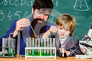 Father and son at school. biotechnoloy research concept. Back to school. Explaining biology to child. bearded man