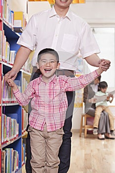 Father And Son In School Classrrom