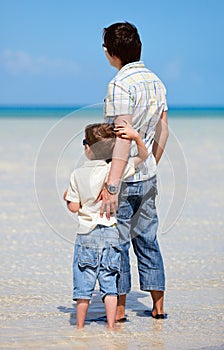 Father and son at shallow water