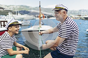 Father and son spending time at marina on summer day