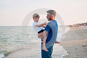 Father son spending time together sea vacation Young dad child little boy walking beach