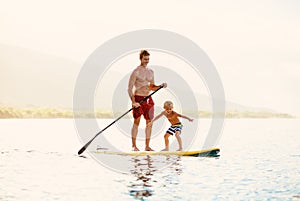 Father and Son Stand Up Paddling