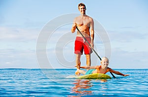 Father and Son Stand Up Paddling