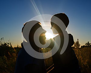 Father and son at sunset