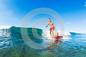 Father and Son Surfing, Riding Wave Together