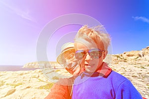 Father and son taking selfie while travel in