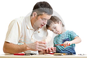 Father and son tinkering together