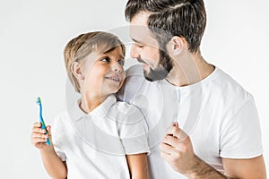 Father and son with toothbrushes