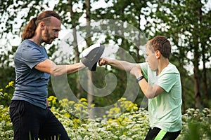 Father and son training to box