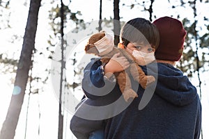 Father and son using air masks