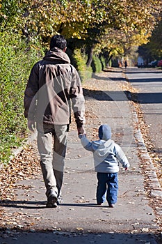 Father and son walking