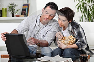 Father and son watching TV