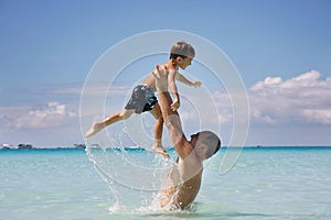 Father and son in water